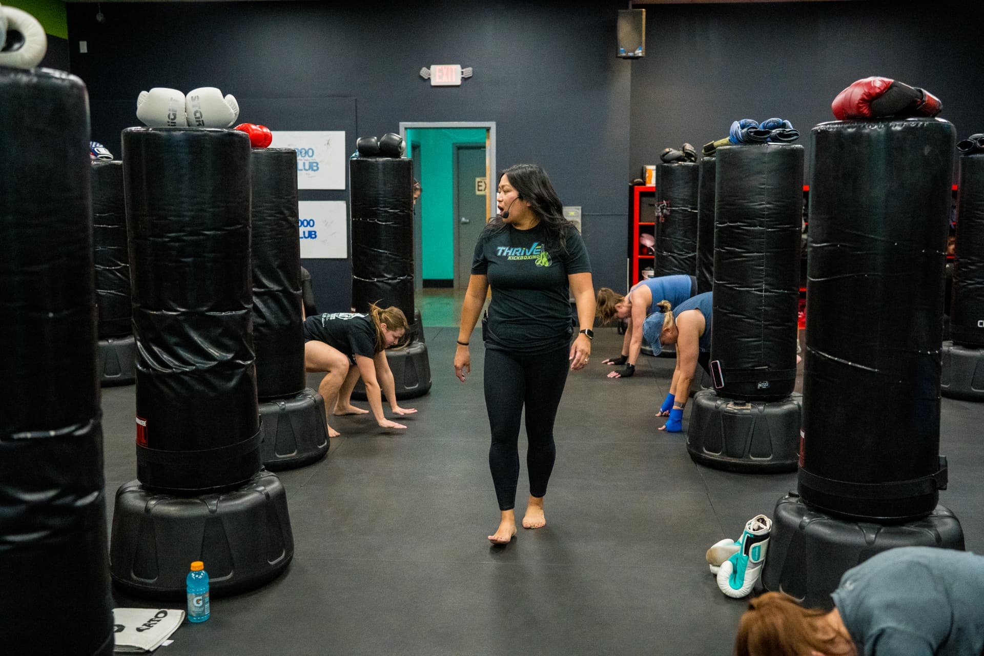 A Thrive Kickboxing coach guiding members through a class at the Las Vegas studio